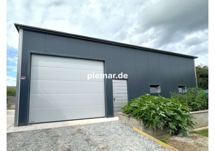 garage-12x9x410-m-mit-einer-dachneigung-nach-hinten-1x-sektionaltor-inkl-elektroantrieb-3x-fenster-2x-tuer-attika-dachblende-kantenschutz-dachrinne-in-farbe-konstruktion-aus-verzinkten-vierkantprofilen-isolation-statik_7