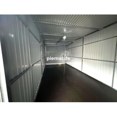 blechgarage-mit-schwingtor-elektroantrieb-tuer-1x-fenster-attika-kantenschutz-konstruktion-aus-verzinkten-vierkantprofilen-in-holzdekofarbe_4