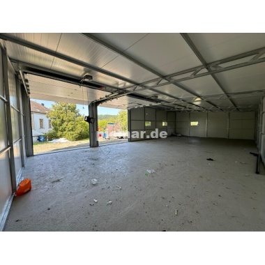 blechgarage_garage_mit_dachneigung_nach_hinten_konstruktion_aus_verzinkten_vierkantprofilen_3x_fenster_2x_sektionaltor_elektroan_7_119026284