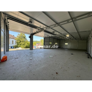 blechgarage_garage_mit_dachneigung_nach_hinten_konstruktion_aus_verzinkten_vierkantprofilen_3x_fenster_2x_sektionaltor_elektroan_8_1873896063