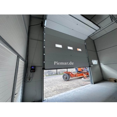garage-halle-blechgarage-mit-einem-satteldach-tuer-fenster-lichtband-sektionaltor-dachrinne-attika-dachblende-konstruktion-aus-verzinkten-vierkantprofilen-in-farbe-verankerung-isolation_16